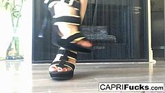 Capri masturbates in her high heels.