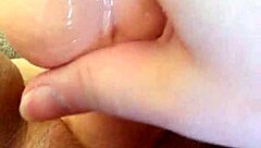 She masturbates with dildo for her man.