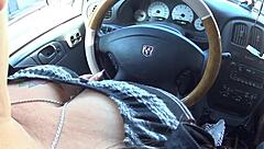 Driving while showing off his wife