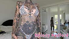Melody Radford Tries On White And Purple Micro String Bikini