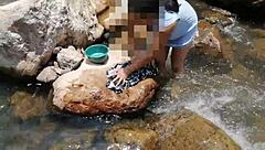 i'm washing clothes in the river
