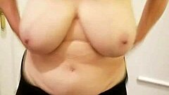 Busty granny flaunts her assets in a solo video