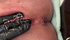 European amateur shows off pierced pussy and latex gloves while fingering to climax