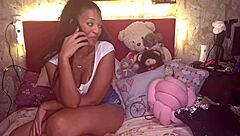 Slim ebony MILF dominates partner's genitals in fetish video