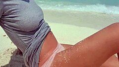 Sexy blonde rubs herself by sea with sandy hot ass
