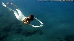 Hot ginger babe swimming underwater in Tenerife bikini scene