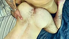 A muscular hunk enjoys a gay blowjob and intense anal sex with a well-endowed bear