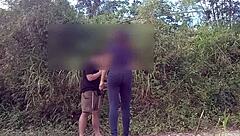 Aroused Asian couple engages in outdoor sex with vocal enthusiasm
