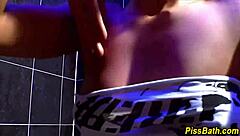 Look at this piss-drenched slut blowing and jerking off the group hard!