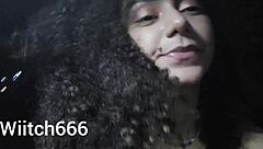 young latina brunette is walking and showing off her outfit on the street in public