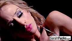 Tattooed milf Sarah casually stuffs her pussy with a red toy