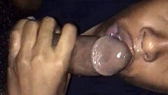 The black monster cock receives an intense blowjob