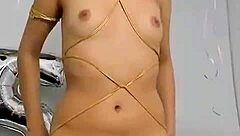 Young latina performs sexy striptease undressing to reveal tits and ass