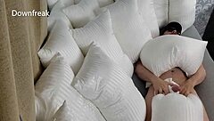 Indulging in sensual pillow play and masturbating on the bed