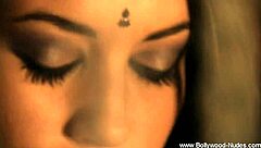 brunette belly dancer strips and dances seductively with clothes ripped