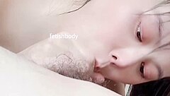 She licks balls and gives a facial blowjob