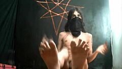 Bearded lady teases with feet and cock