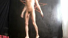 Bearded lady teases with feet and cock