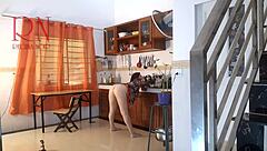 Naked maid achieves orgasm while preparing food in kitchen