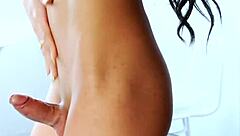 Adorable brunette shemale Naey masturbates her cock in the bedroom