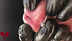 close-up extreme view of latex gloves detailing peehole and cumshot