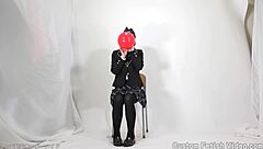 I watch a girl play with balloons.