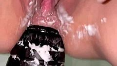 Amateur inserts anal tower dildo close up