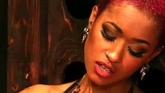 Black domme in lingerie and boots dominates with strapon