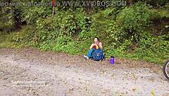 Athletic Brunette Rides Bike in Public Park