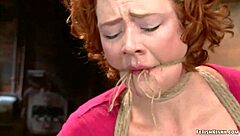 ginger milf tied up and fingered in hogtie position