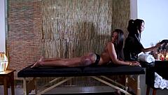 Two provocative ladies indulge in a sensual massage session