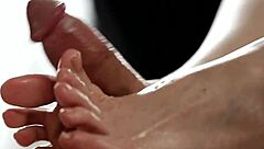 Cutie strokes monster cock with feet! Babe gives hot footjob leading to huge cumshot on small tits.