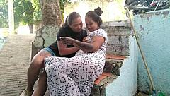 An older woman interrupts a young lesbian during a masturbation session with her mouth