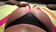 Homemade video of amateur Latina oiling up her big, fat ass
