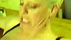 Older woman indulges in anal and tits play with a partner