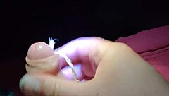 Intriguing slave cums on command, showing off his cock for your pleasure in this fetish scene.