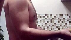 Gay man cleaning up the kitchen in HD