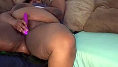 A plus-sized black woman's pussy ejaculating on the sofa