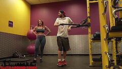 Personal trainer gives private lesson to guy at the gym
