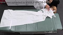 Doctor examines pierced patient in hospital office