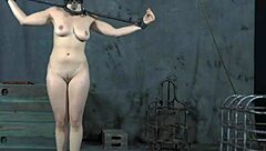 Bound brunette gratifies herself with toy on tits