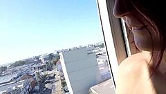 naked at hotel window in front of airport with big tits