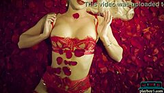 Stunning blonde adult film actress Elsa Jean provocatively posing in a field of flowers, exuding seduction