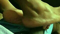 wife gives footjob to husband at home