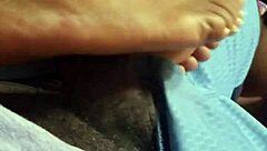 wife gives footjob to husband at home