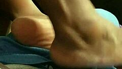 wife gives footjob to husband at home