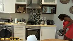 A curvy African-American mother with a big rear end and large white penis engages in sexual activity in the kitchen, resulting in ejaculation