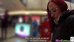 A busty redhead gives a passionate blowjob