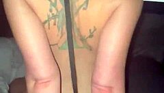 My boyfriend's tattooed body and big dick satisfy my desires as I ride him during porn