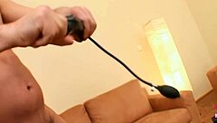 A blonde in leather receives double penetration with a strapon for an explosive climax
